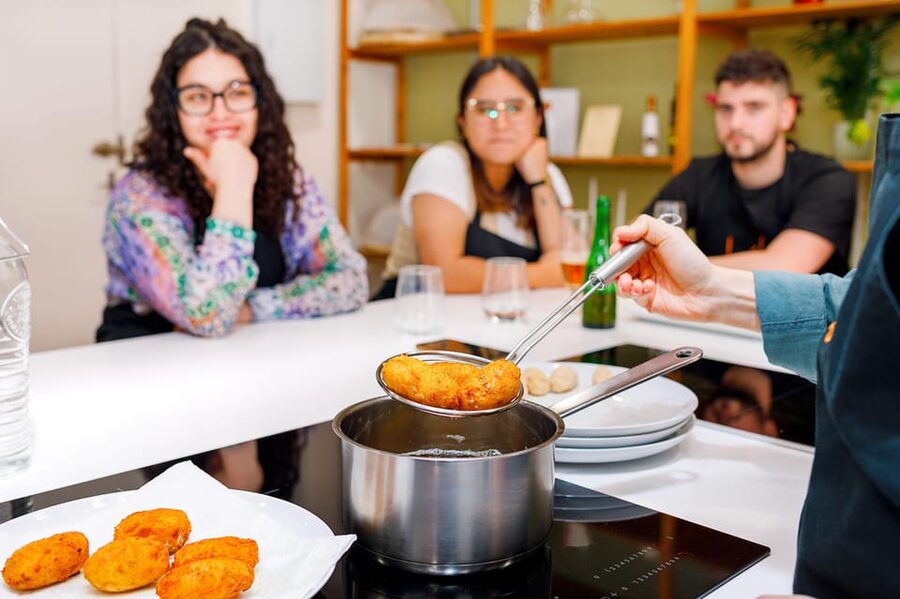 Authentic Tapas Cooking Class at a Private Eatery in Madrid - Paella night in a small room: black ink squid plus vegetarian options