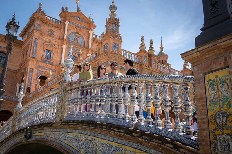 From Madrid: Best of Sevilla Day Tour with Train Transfers - The guided walk: Alcázar, Giralda, and Cathedral facades up close
