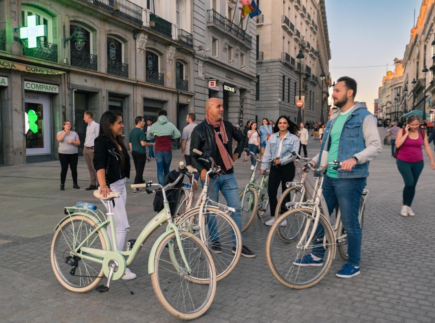 Madrid by Night: Vintage Bike Tour Highlights/Optional Tapas - Gran Vía at night: famous avenue, quick photo moments, real street guidance