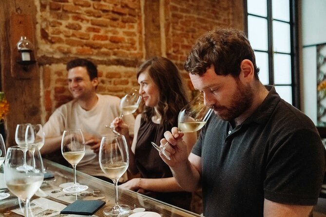 Madrid Evening Tapas and Wine Guided Tour - Muñiz tavern classics, including slow-cooked stew