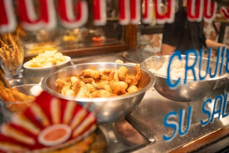 Madrid: Evening Tapas Tour with 5 Delicious Stops & Drinks - La Latina’s Madroño Liquor and Chorizo Moment