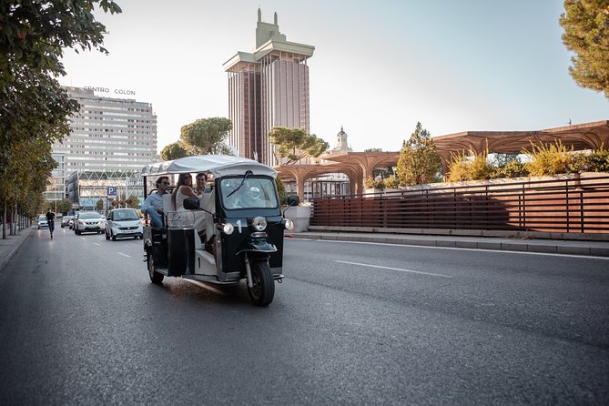 Madrid Expert Tour with Local Guide in Eco Tuk Tuk Private - Spanish Courts and the story behind the big stone door