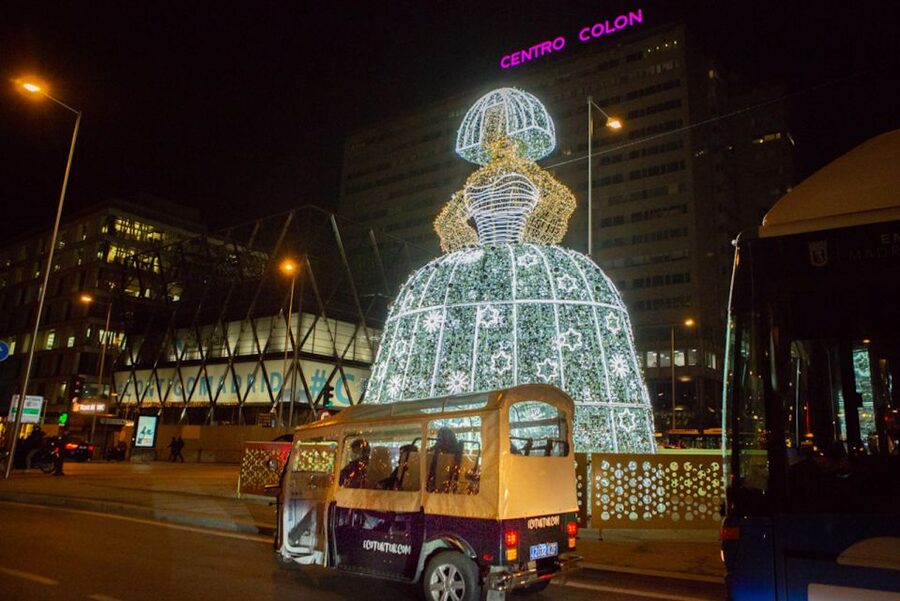 Madrid: Private Christmas Lights Tour by Eco Tuk-Tuk - Plaza Colon and the National Library: the stop that turns a building into a centerpiece