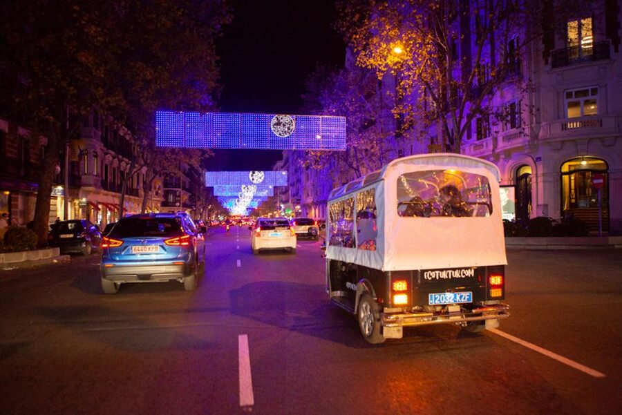 Madrid: Private Christmas Lights Tour by Eco Tuk-Tuk - Neptune Fountain at Plaza de Cánovas: the romantic payoff photo