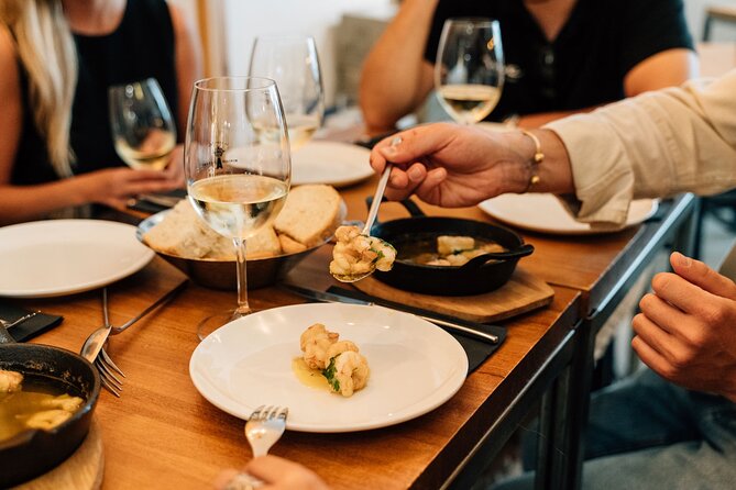 Madrid Tapas & Wine Tour with Rooftop Views and Local Guide - Stop 3: Carrilleras at a Renovated Casa de Comidas