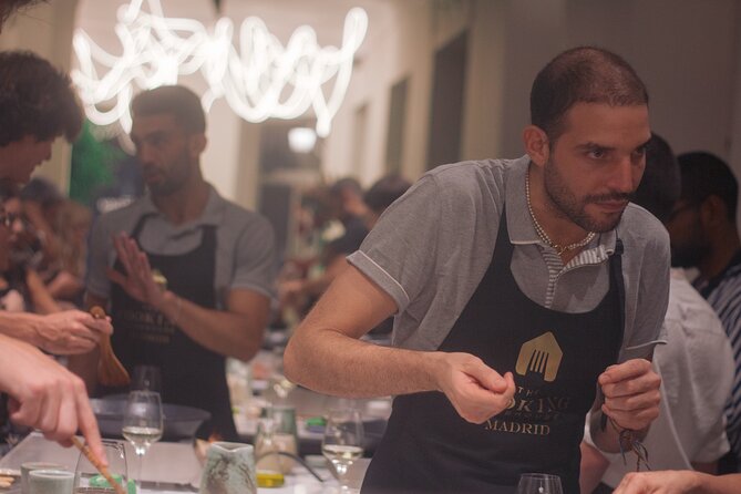 Paella Cooking Class in Madrid with Bottomless Wine Pairing - From Cava welcome to custom cooking stations